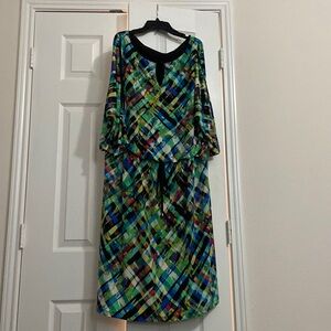 Colorful plus size dress with peep hole neckline and sleeves.